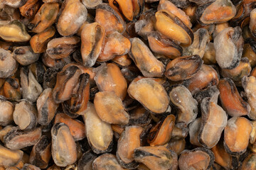 Frozen seafood. Background of frozen mussels in glaze.