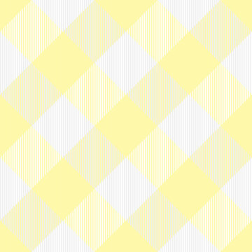 Diagonal tartan Easter plaid. Scottish pattern in white and yellow cage. Scottish cage. Traditional Scottish checkered background. Seamless fabric texture. Vector illustration