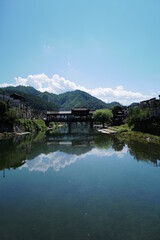 Fototapeta na wymiar Old Chinese village with mountain and river natural surrounding