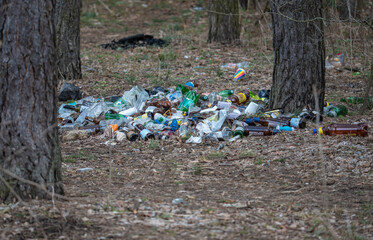 abandoned garbage after a picnic in the woods. environmental disaster