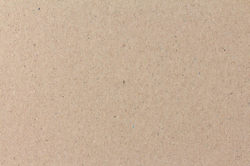 Texture of an ordinary brown sheet of cardboard
