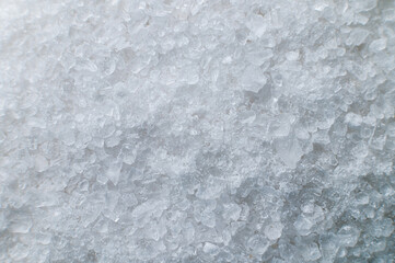 Macro view of crystals of table salt. Taste useful additive saline solutions background in shallow depth of field. Close-up