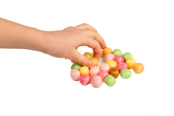 Child taking a candy on a white background