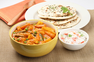 Indian food Mix vegetable curry with Tandoori roti or nan, Indian flat bread