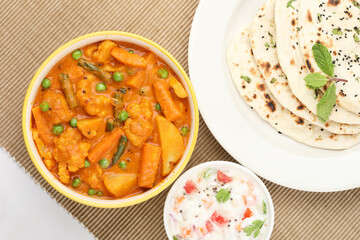 Indian food Mix vegetable curry with Tandoori roti or nan, Indian flat bread