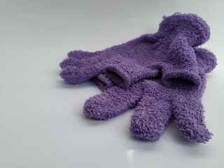 Purple gloves on a white background