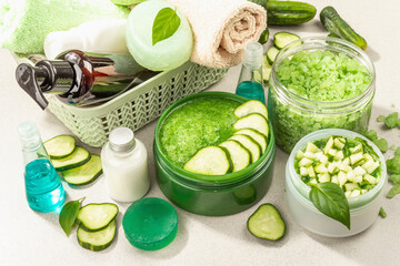 Fototapeta na wymiar Homemade cosmetics with cucumber. Natural cream, sea salt, body lotion, and soap