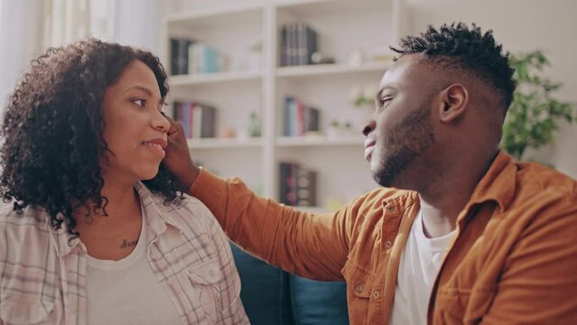 Handsome African American man saying compliments to his partner, relationship