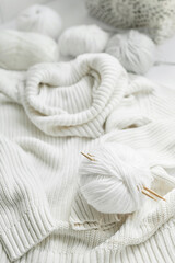 Knitted kids clothes and accessories for knitting. Needlework and knitting. Hobbies and creativity. Knit for children. Handmade. Hobbies and creativity.