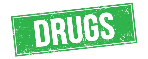 Fototapeta premium DRUGS text on green grungy rectangle stamp.