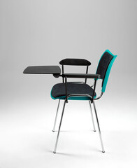 Office chair with writing tablet, on white background
