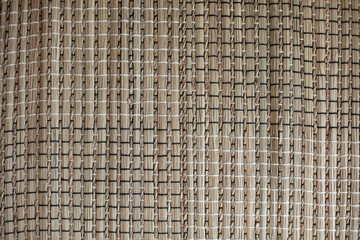 texture of a natural wicker rug made of goutweed and algae.