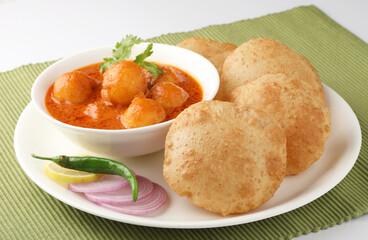 Indian food - Puri Bhaji. North India. Puri is a deep fried bread made from whole wheat flour & Served with Potato curry , bhaji or alu ki sabji.or Potato curry or dum alu curry