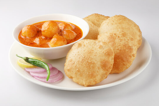 Indian food - Puri Bhaji. North India. Puri is a deep fried bread made from whole wheat flour & Served with Potato curry , bhaji or alu ki sabji.or Potato curry or dum alu curry
