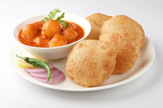 Indian food - Puri Bhaji. North India. Puri is a deep fried bread made from whole wheat flour & Served with Potato curry , bhaji or alu ki sabji.or Potato curry or dum alu curry