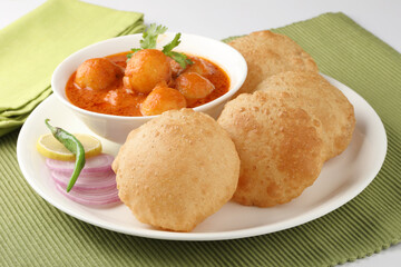 Indian food - Puri Bhaji. North India. Puri is a deep fried bread made from whole wheat flour & Served with Potato curry , bhaji or alu ki sabji.or Potato curry or dum alu curry