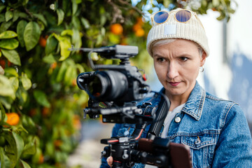 Camera operator with movie setup outdoor