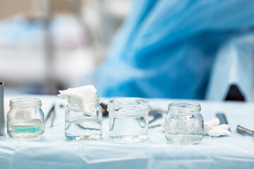 Medical jars on the table in the surgical room