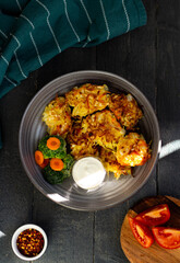 Cabbage cutlets with sour cream, broccoli and carrots. Top view. Flat lay.