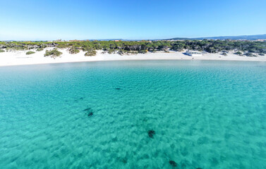 Obraz premium Aerial view of Maria Pia beach under a blue sky