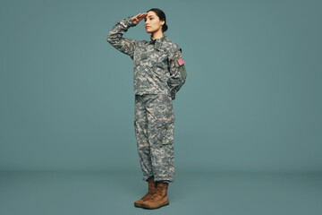 American soldier saluting in a studio
