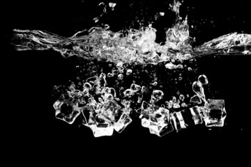 Panele Szklane  Ice cubes in water on black background.  ice in motion, isolated on black background. ice cubes on black background splashing water