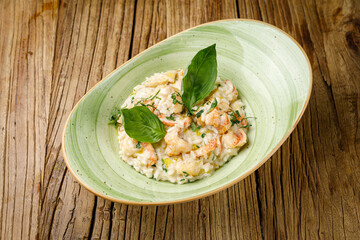 risotto with vegetables on a wooden table
