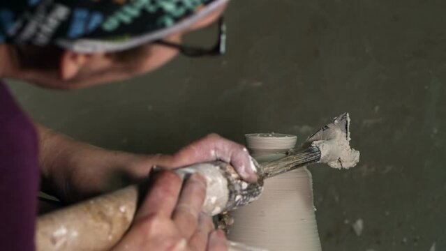 Art Working in a Ceramic Workshop Close Up Detail