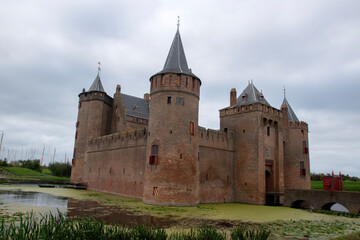 Fototapeta na wymiar Side View At The Muiderslot Castle At Muiden The Netherlands 31-8-2021