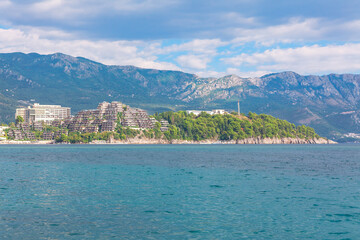 Fototapeta premium Becici beach and hotels in Montenegro . Adriatic Sea and Balkans . Resort of Zavala Peninsula