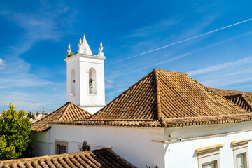 Tower with bell of Misericordia Church in Tavira, Algarve, Portugal