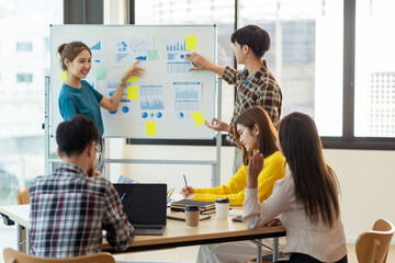 Group of young Asian  business people meeting in casual wear working together on new project.