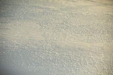 Texture of snow. Background is snowy plain.