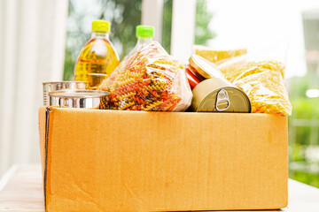 Foodstuffs in donation box for volunteer.
