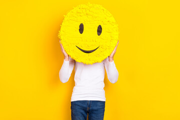Photo of funny funky guy dressed white shirt holding smiley cover face isolated yellow color background