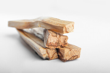 Palo Santo bars close-up and copy space. Ritual cleansing with sacred ibiocai, meditation, aromatherapy with incense and candles..