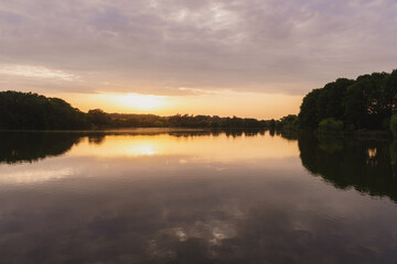 Sunset on the coast of the lake. Natural landscape. Nature of Northern Europe. reflection. landscape during sunset.