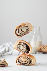 Flying homemade poppy seed buns with milk for the breakfast