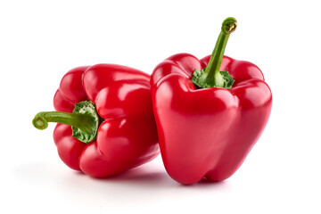 Red ripe bell peppers, isolated on white background.