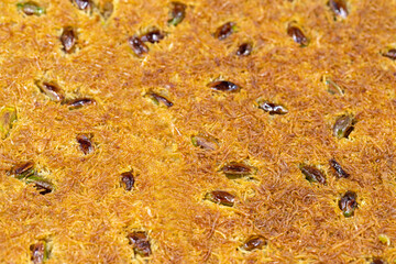 Pistachio kadayif dessert. Traditional Turkish cuisine delicacies. Close-up kadayif dessert