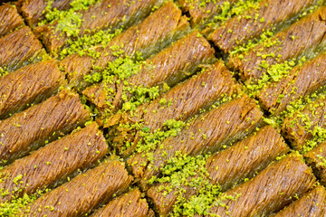 Pistachio kadayif dessert. Traditional Turkish cuisine delicacies. Close-up kadayif dessert. Local name sarma kadayif