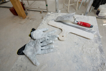 Attic finishing construction site in the phase drywall spackling and plastering before screeding
