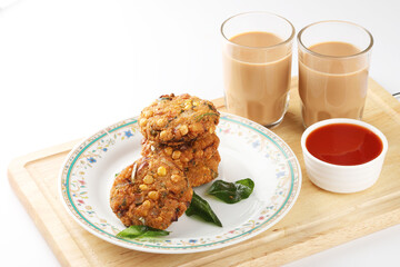 Tea time snack, Dal Vada or Parippu Vada or Paruppu Vadai , deep fried snacks savory food from Kerala fried in coconut oil.
