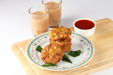 Tea time snack, Dal Vada or Parippu Vada or Paruppu Vadai , deep fried snacks savory food from Kerala fried in coconut oil.