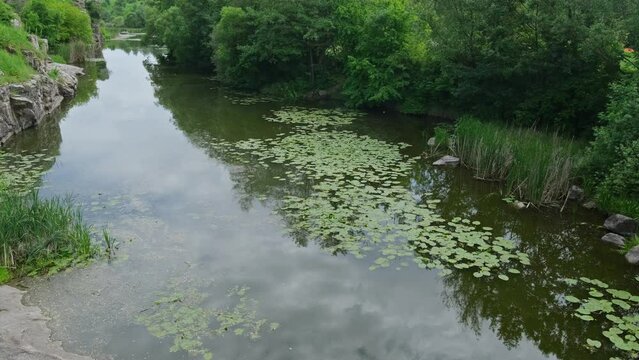 Buky Canyon summer landscape, Hirskyi Tikych river, Cherkasy Region, Ukraine. Cars and people unrecognizable.
