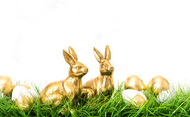Easter bunnies golden eggs green grass background