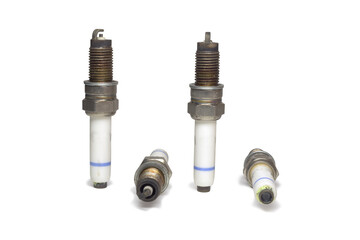 spark plugs kit, showing all sides, old, on white background, with clipping path