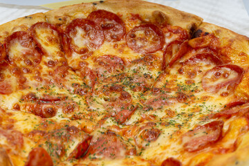 Delicious looking pizza with various fresh ingredients added