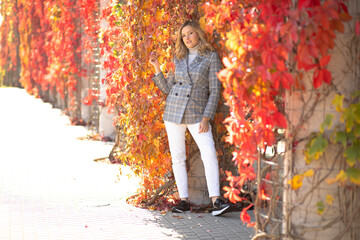 Portrait blond beauteous confident woman traveler in tour walking stone road, near historical building center, stairs 