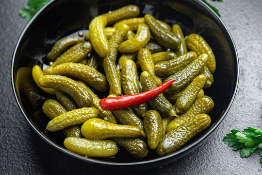 gherkins cucumbers salted pickled vegetable food meal food diet snack on the table copy space food background 